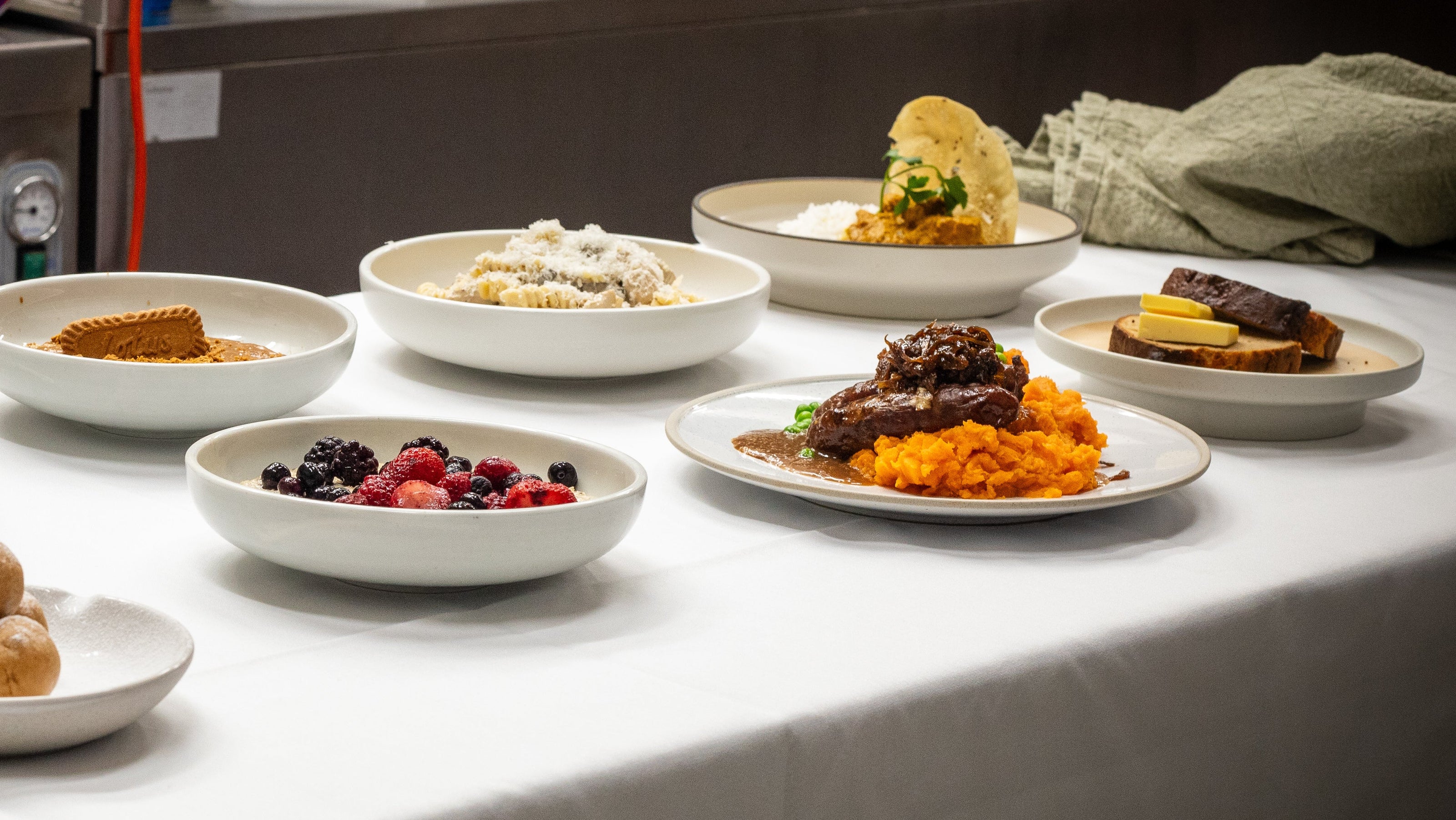 Fuel & Prep Co chef-prepared high-protein ready meals and healthy snacks displayed on a table, including fresh meals, desserts and breakfast options, for Bundles.