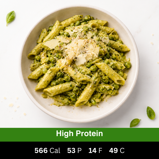 High-protein creamy chicken pesto penne pasta served with green peas and shaved parmesan. Fresh ready-made meal by Fuel & Prep Co.